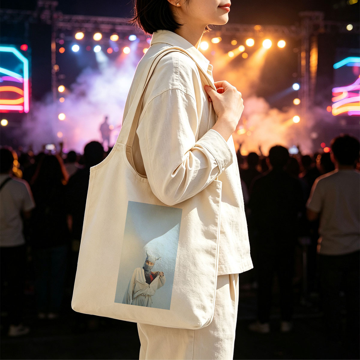 Billie Eilish in a whimsical winter scene wearing a horned knit mask and flowing white outfit against a clear blue sky - Canvas shoulder bags/