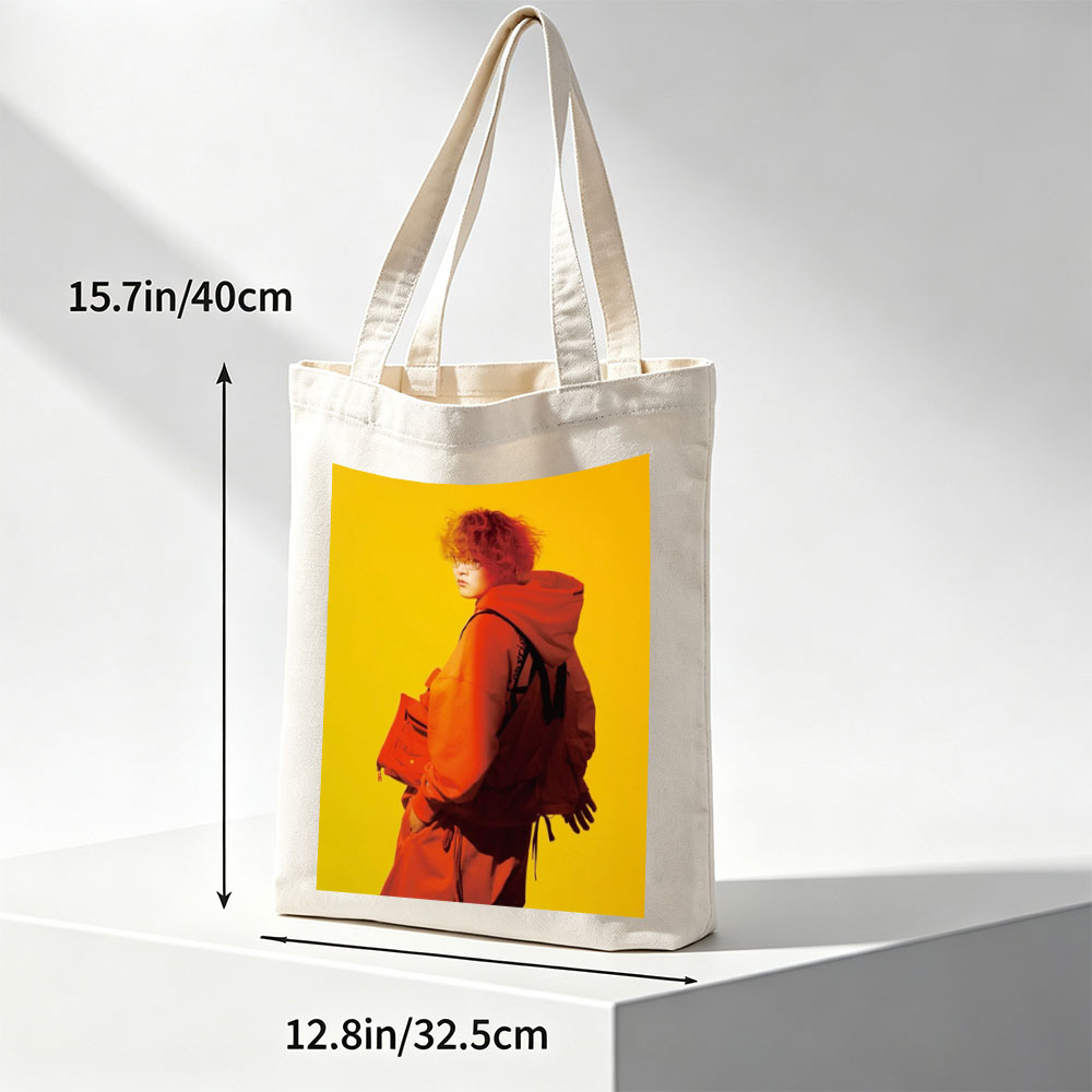Yuta from Exile Tribe in a Bold Orange Outfit with a Backpack Against a Vibrant Yellow Background - Canvas tote bags