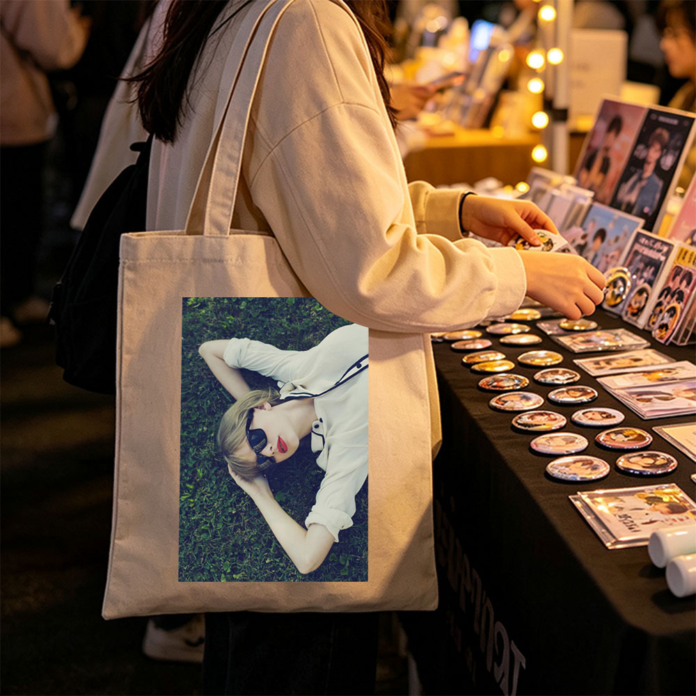 Taylor Swift Lying on Grass Wearing Sunglasses and Red Lipstick - Canvas tote bags