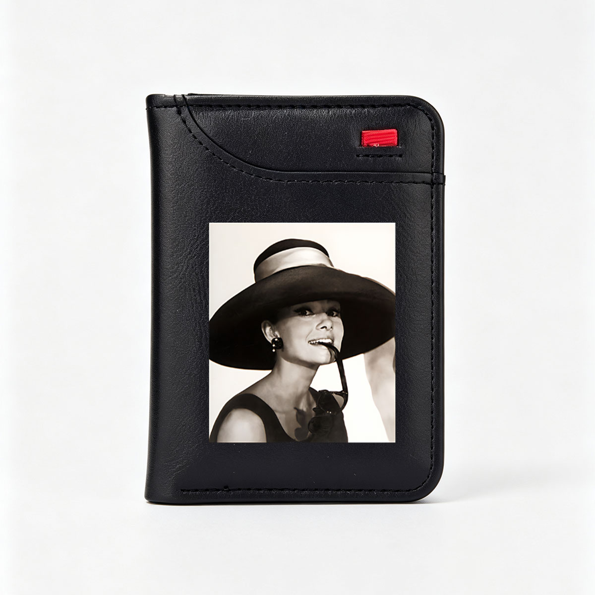 Audrey Hepburn in a wide-brimmed hat and sunglasses, exuding elegance and charm. - Vertical Style Wallet