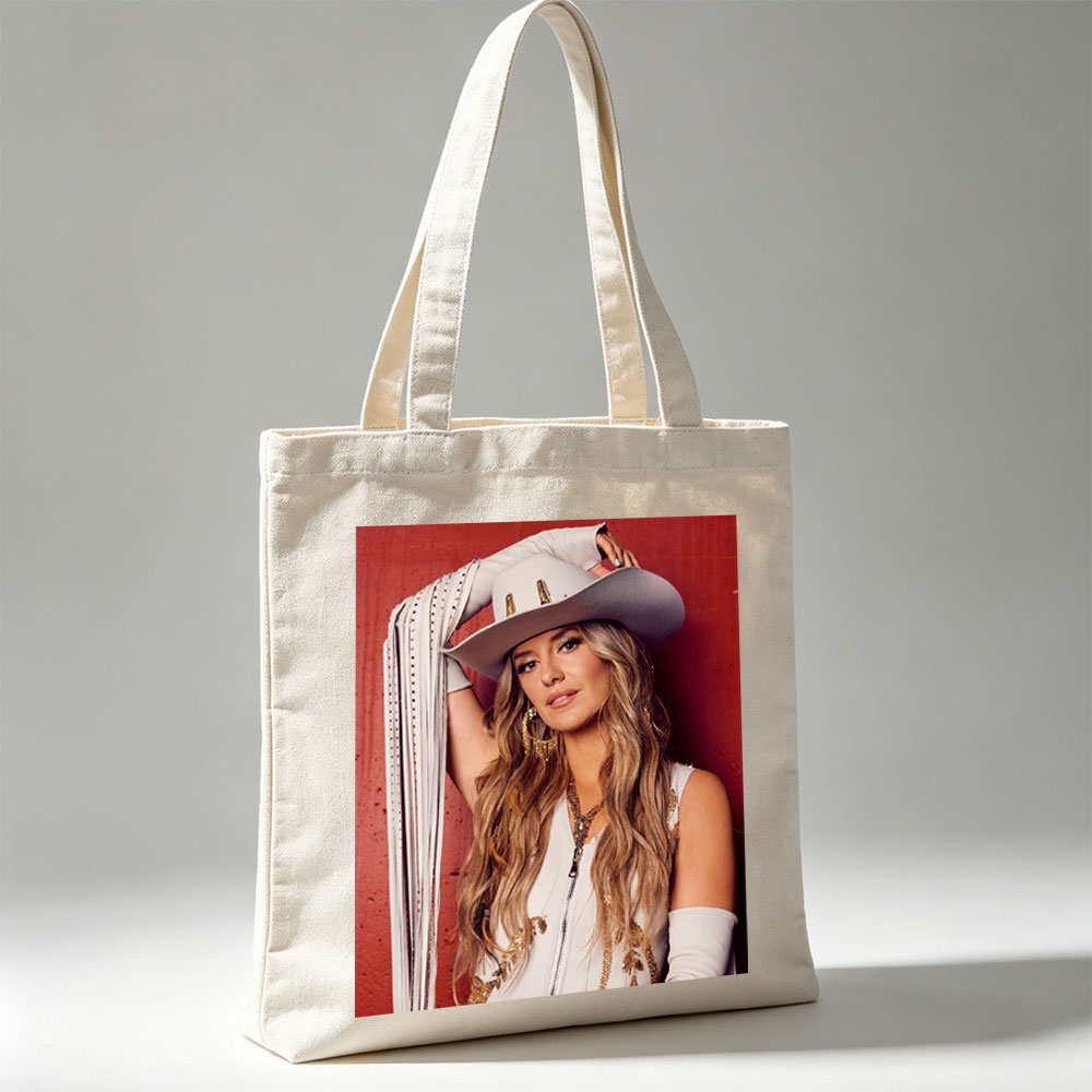Lindsay Ell in a Cowboy Hat and Western Outfit Against a Red Background - Canvas tote bags