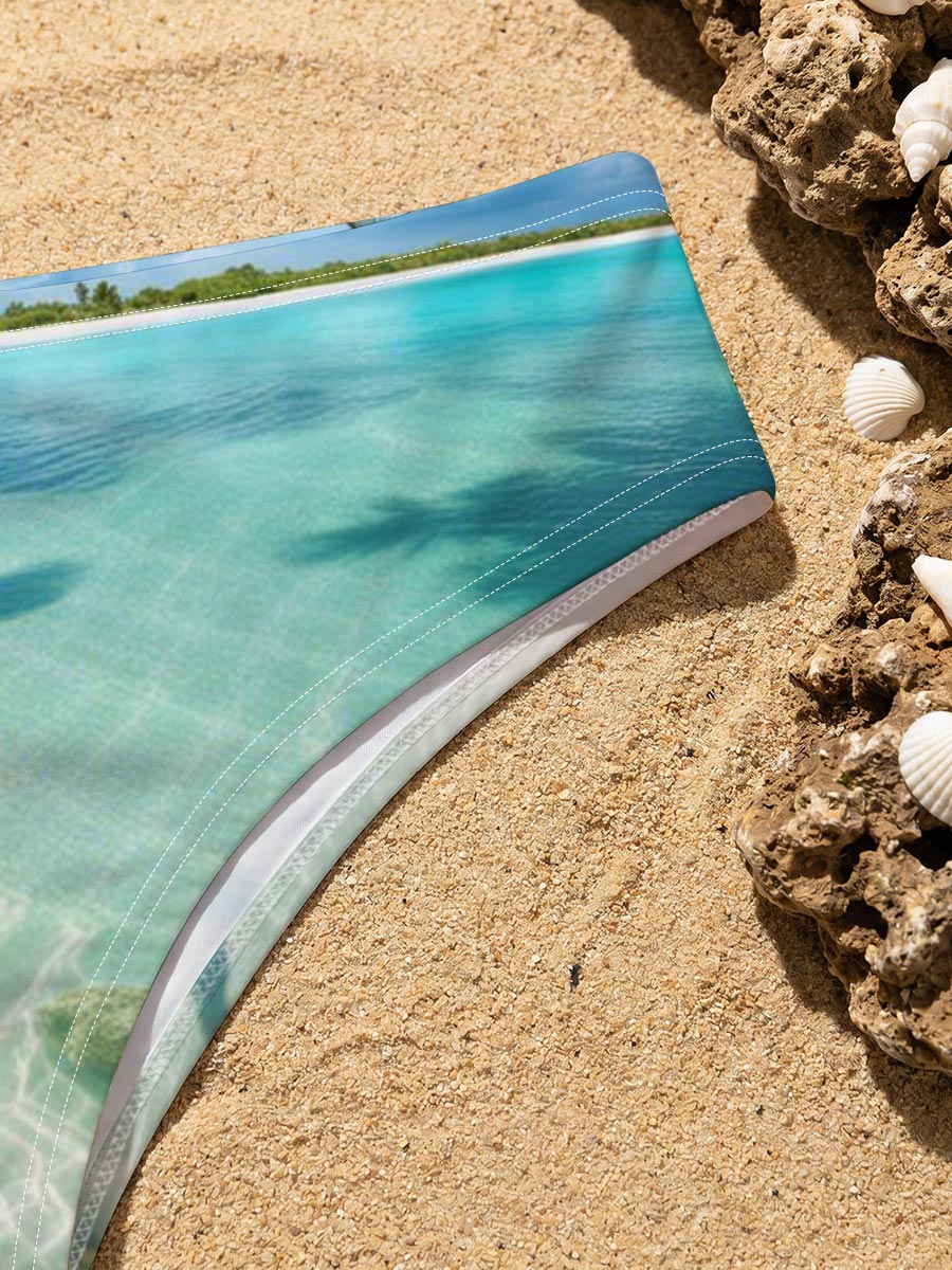 Serene tropical beach with crystal clear water and palm trees -  Men's swim trunks