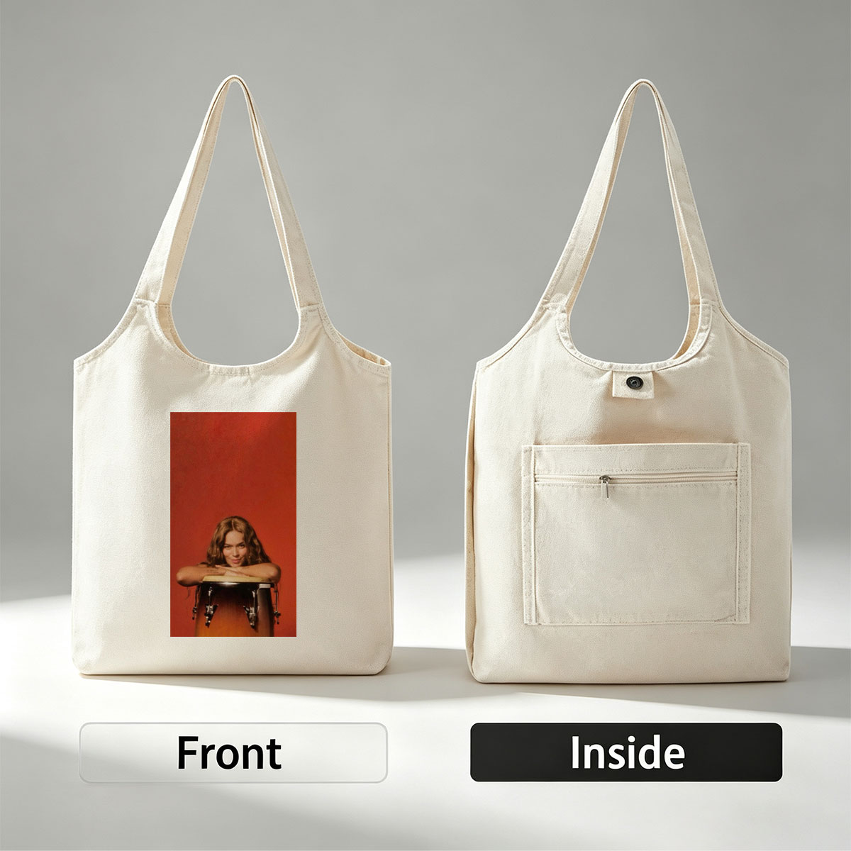 Rita Ora Leaning on a Drum Against a Red Background - Canvas shoulder bags/