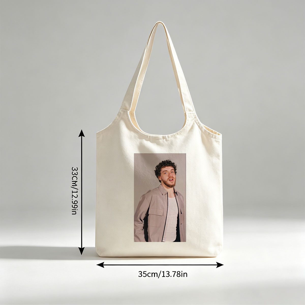 Jack Harlow in a Stylish Pose Wearing a Beige Jacket Over a White Shirt Against a Neutral Background - Canvas shoulder bags/