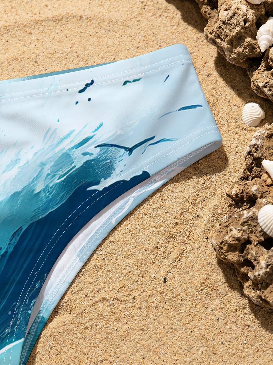 Mighty waves crash against rocks as seagulls soar above the stormy sea. -  Men's swim trunks