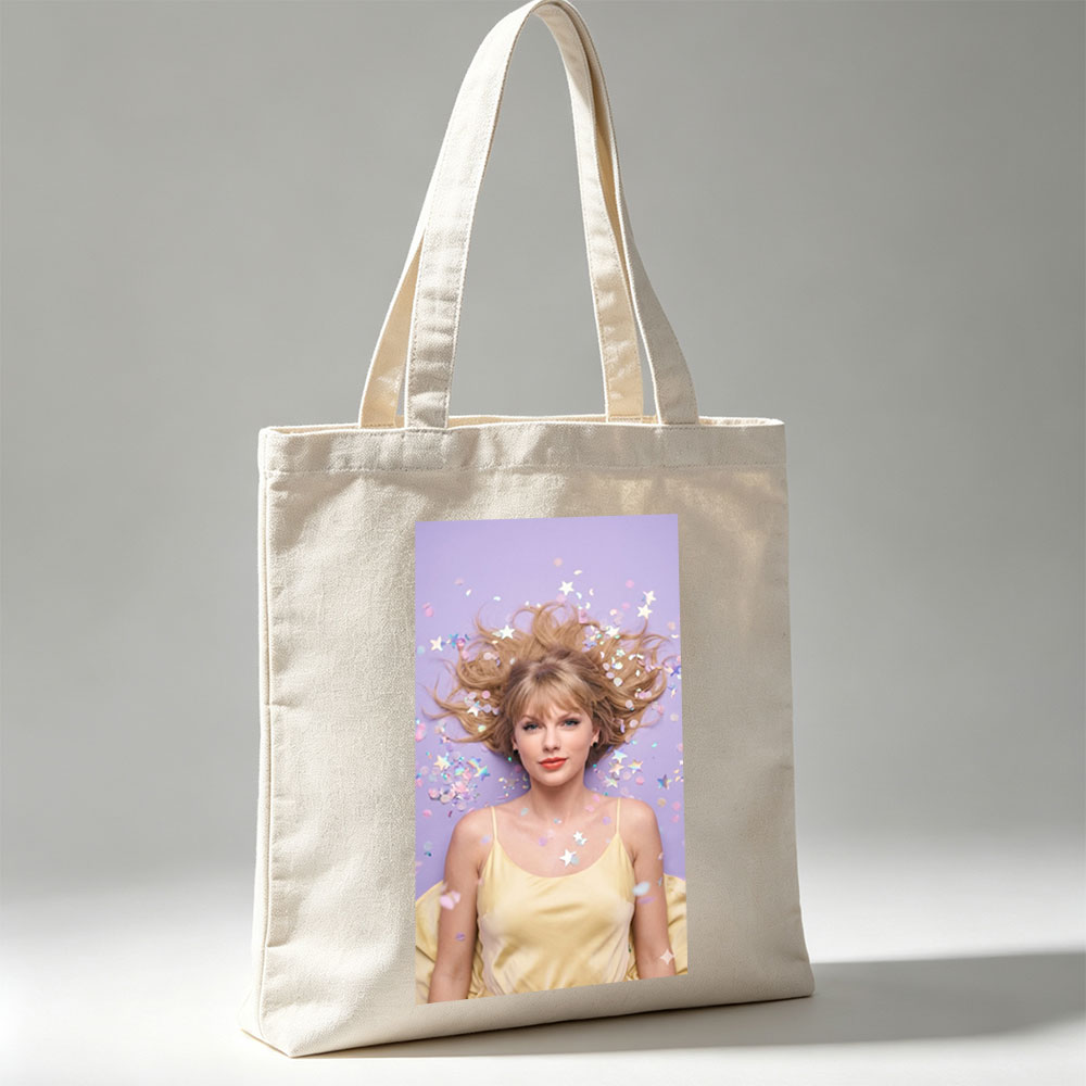 Taylor Swift Lying on Purple Background with Confetti and Stars Around Her Hair - Canvas tote bags
