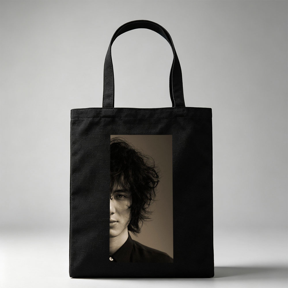 Evan Peters in a Dramatic Portrait with Messy Hair and Intense Gaze - Canvas tote bags