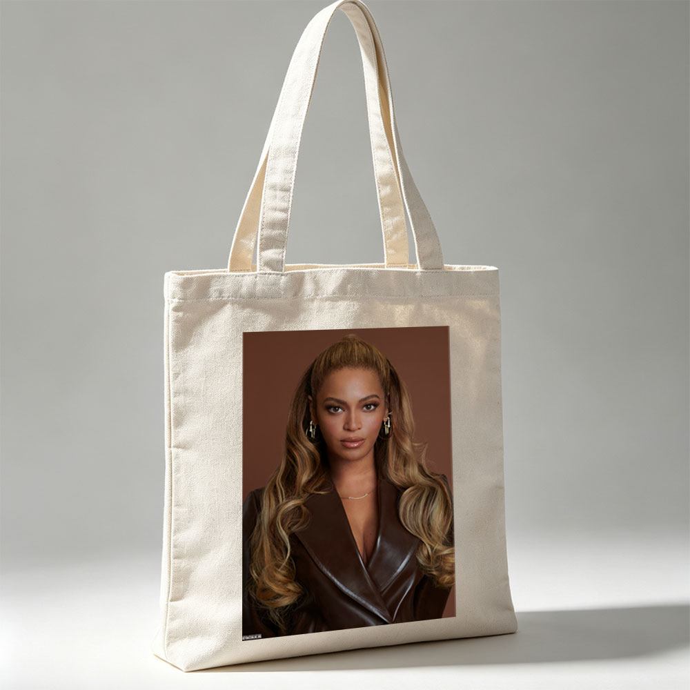 Beyonce in a Bold Brown Leather Look with Elegant Waves and Gold Jewelry - Canvas tote bags