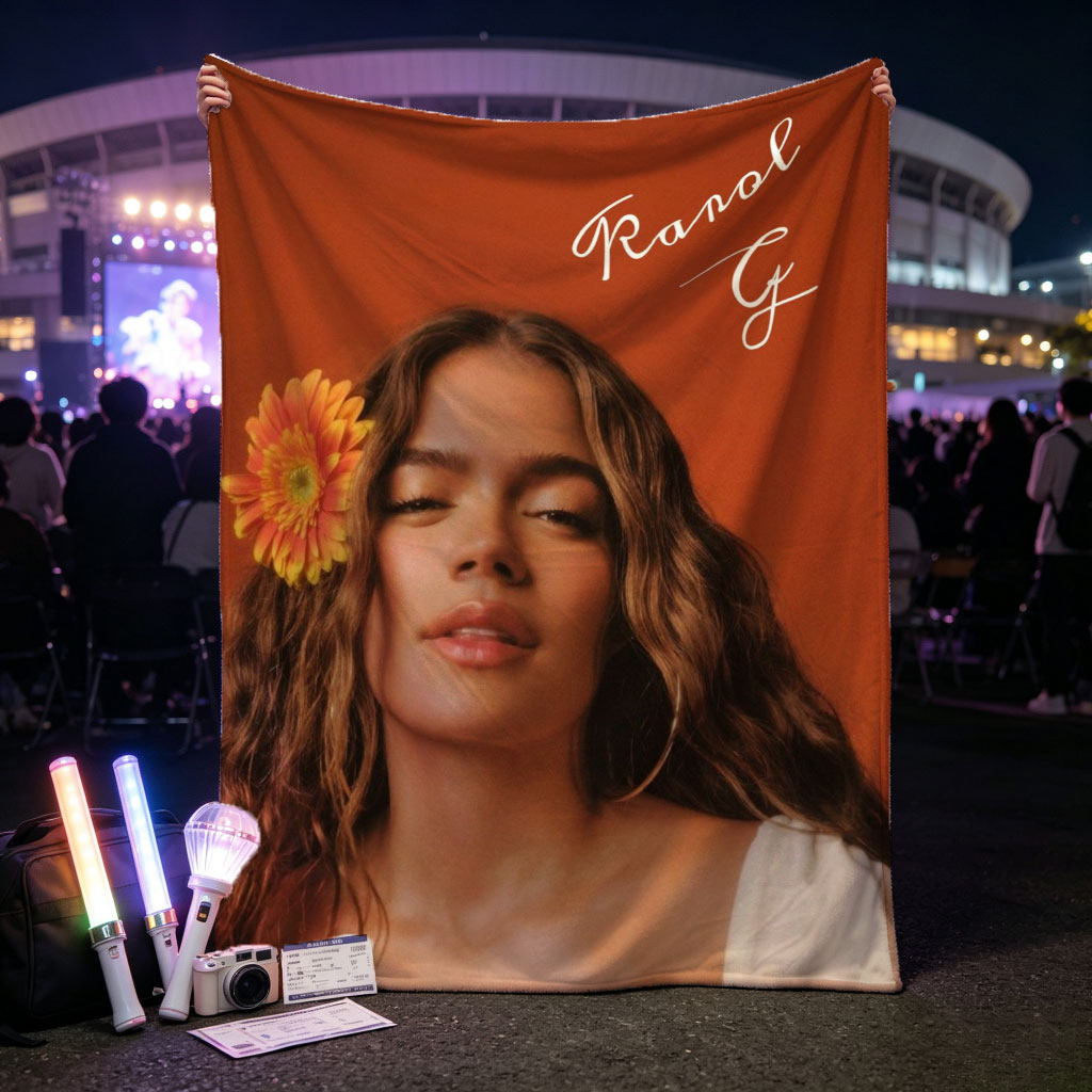 Ranal G with a vibrant orange flower in her hair against a warm terracotta background - Blankets