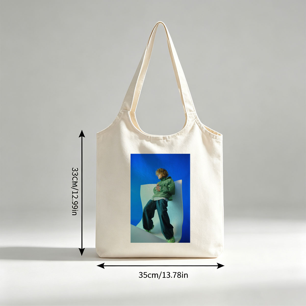 Jaden Smith in a Fashion Shoot Wearing Oversized Green Jacket and Baggy Jeans Against a Blue Background - Canvas shoulder bags/