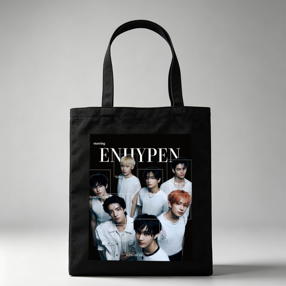 ENHYPEN in a striking black-and-white group portrait featuring all members in minimalist white outfits with individual name labels against a dark background - Canvas tote bags