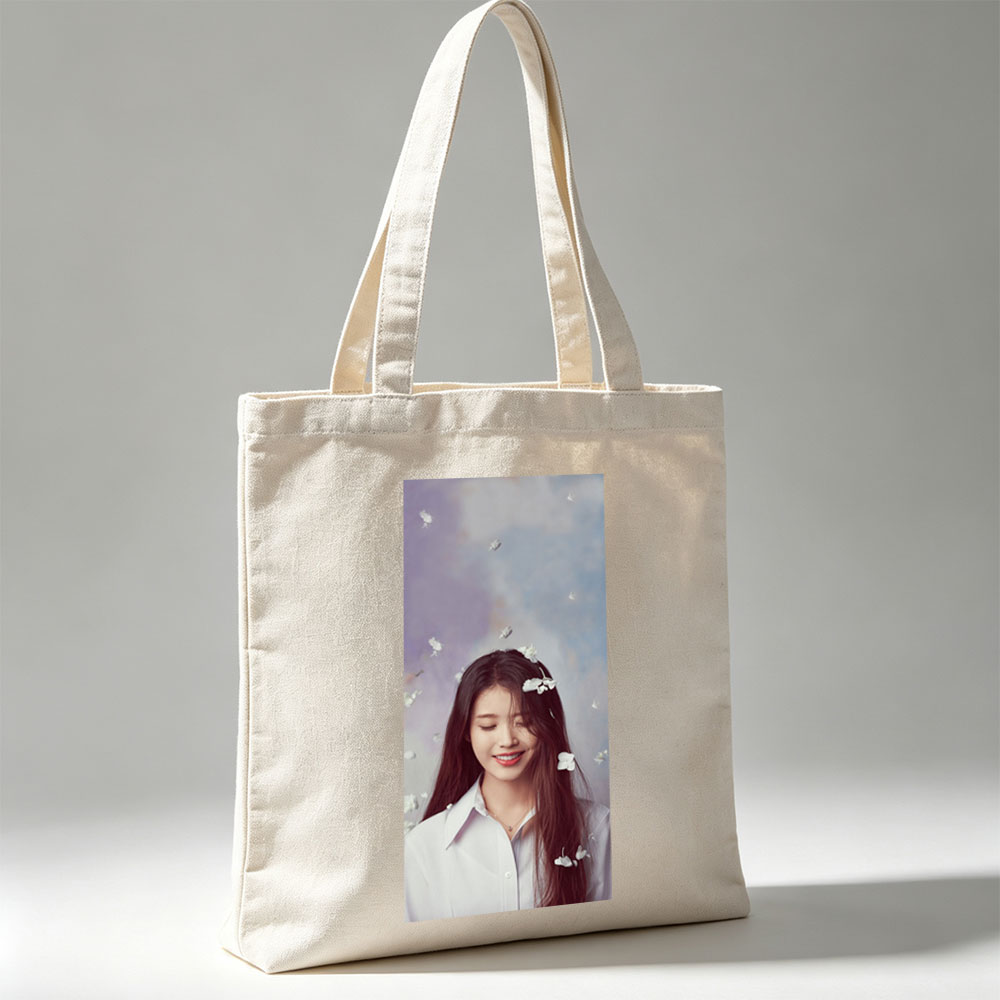 IU in a Dreamy Floral Scene with White Flowers Floating Around Her - Canvas tote bags