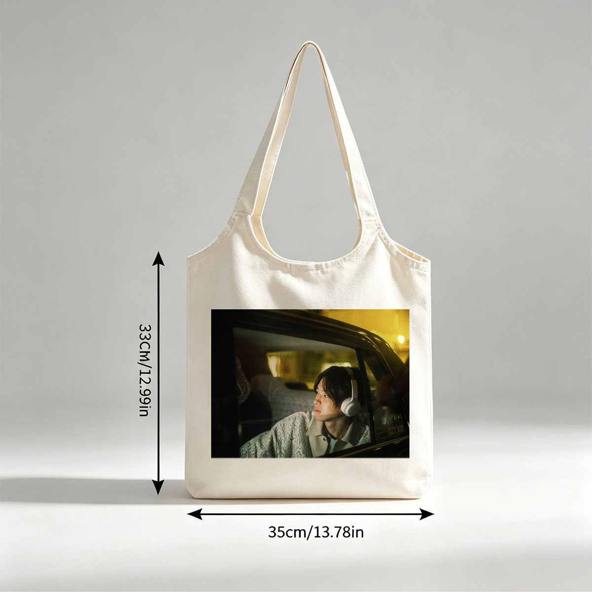 Yosuke Sugino in a Car at Night Wearing Headphones and Looking Out the Window - Canvas shoulder bags/