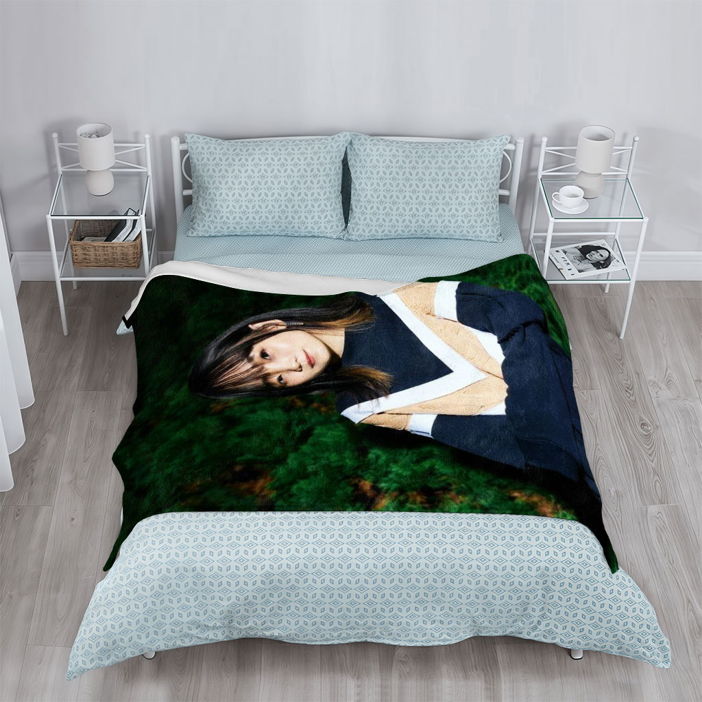 Yui Aragaki in a Stylish Outdoor Portrait with Arms Crossed Against Greenery Background - Blankets