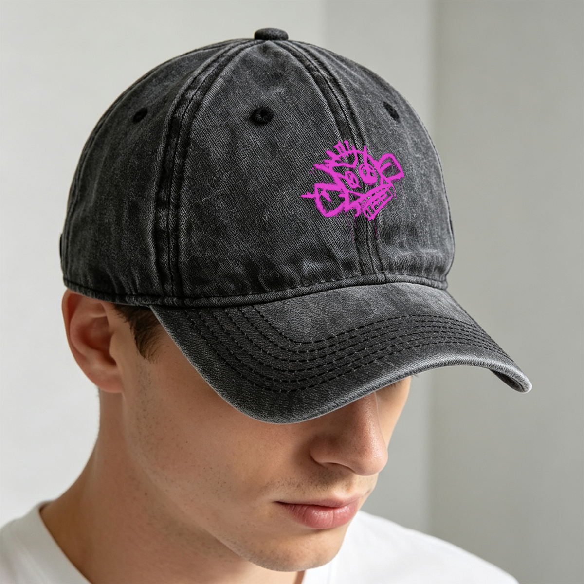 Graffiti-style pink skull with crown and crossbones on black background - Washed Denim - Baseball Cap