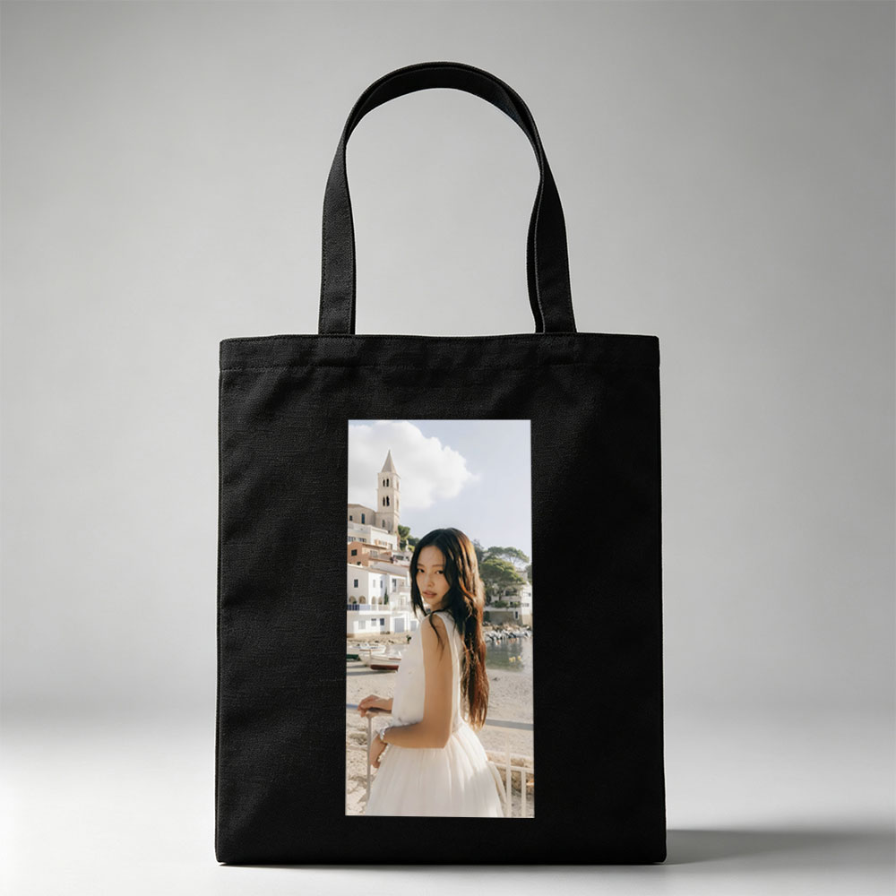 Jennie Kim in a White Dress by the Seaside with a Church Tower in the Background - Canvas tote bags