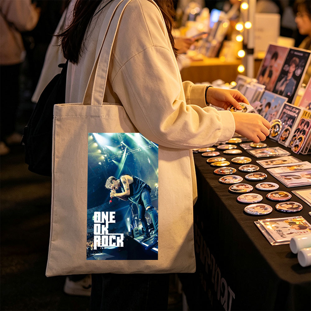 ONE OK ROCK Live Performance on Stage with Dynamic Lighting and Energetic Crowd - Canvas tote bags