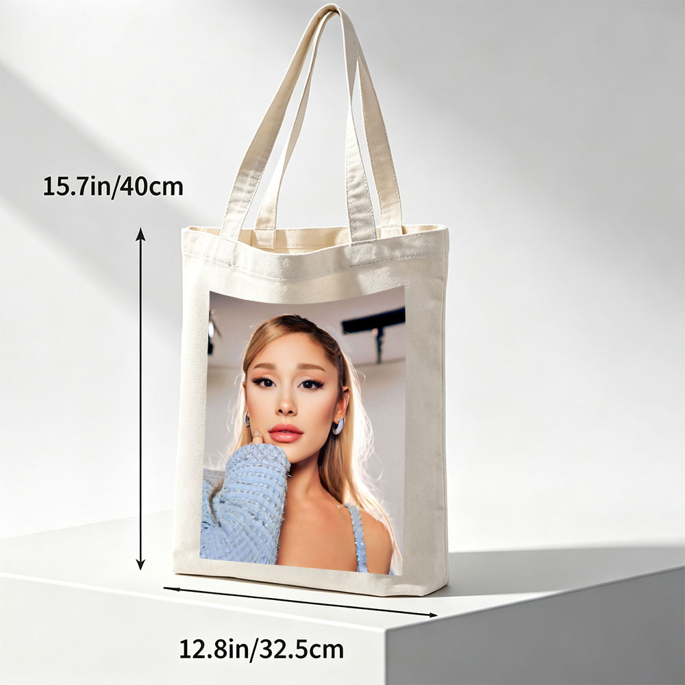 Ariana Grande in a Serene Moment Wearing a Light Blue Textured Top and Elegant Earrings - Canvas tote bags