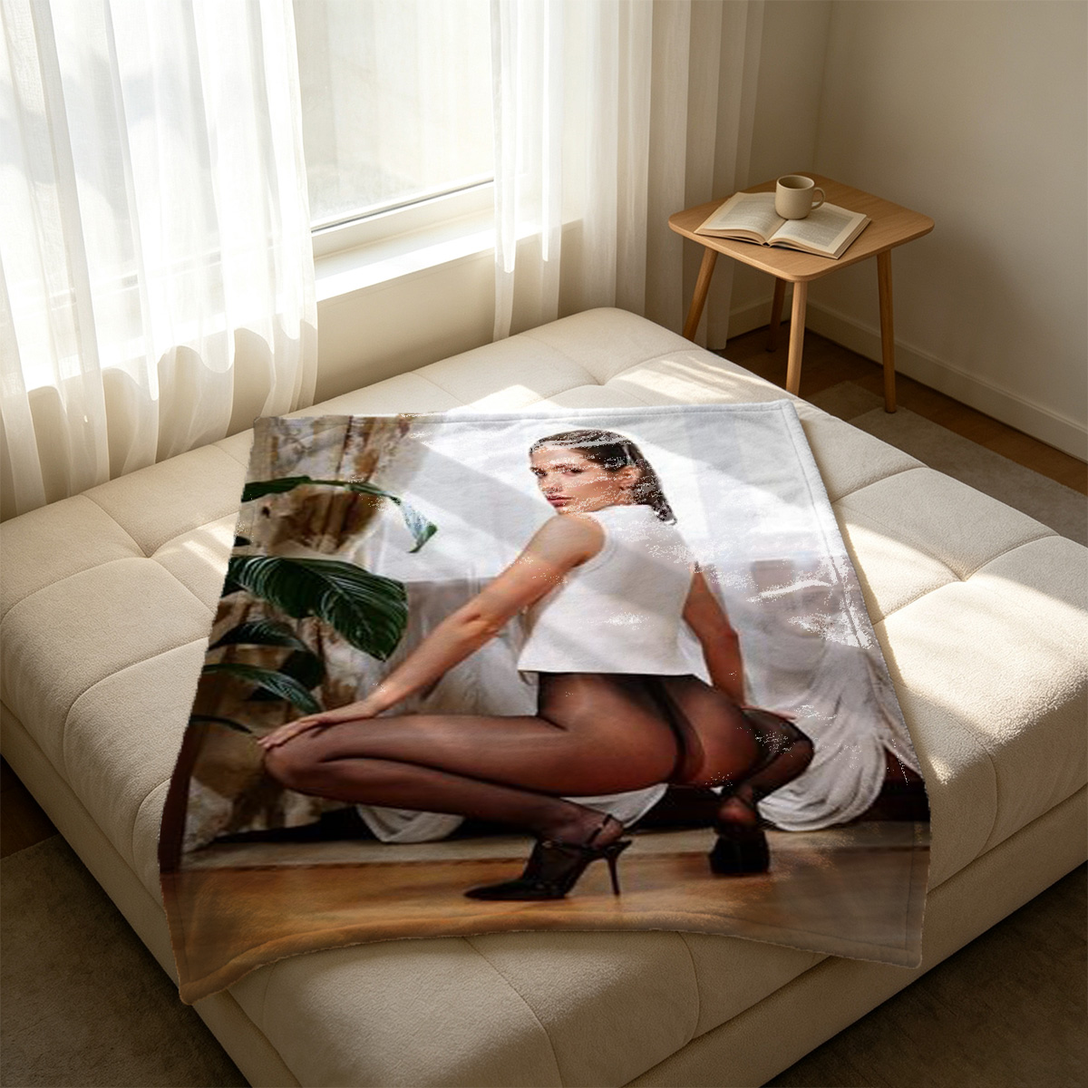Young woman in a shiny blue satin mini dress posing on a leather couch. - Blanket