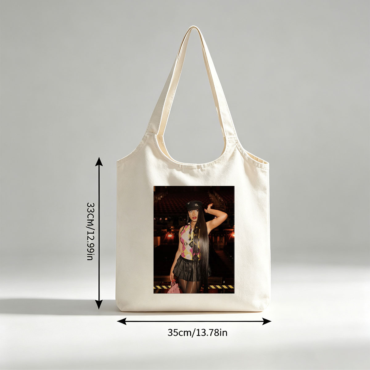 Cardi B in a Bold Outfit at a Concert Venue with Vibrant Lighting and Stage Setup - Canvas shoulder bags/