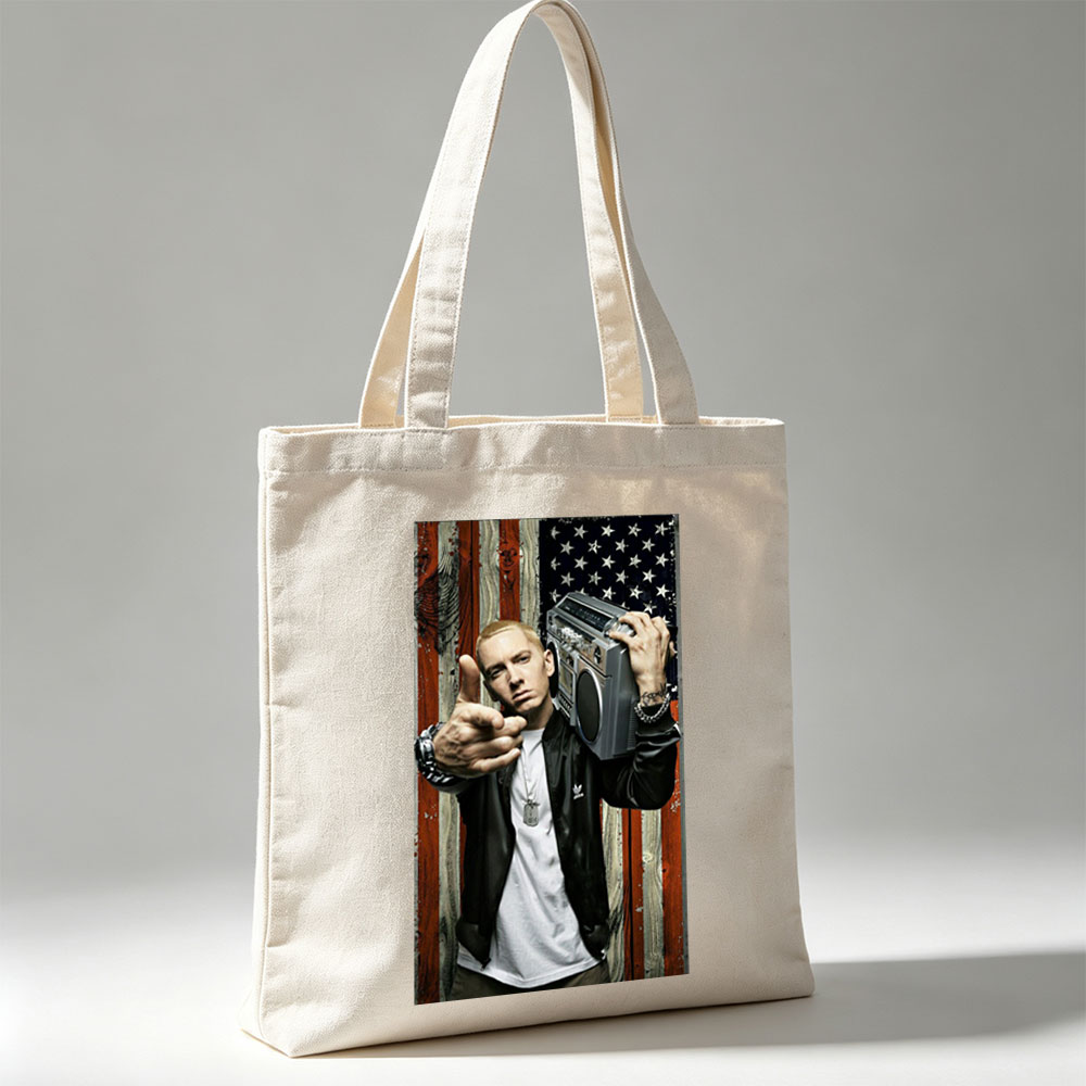 Eminem Holding Boombox Pointing at Camera Against American Flag Background - Canvas tote bags