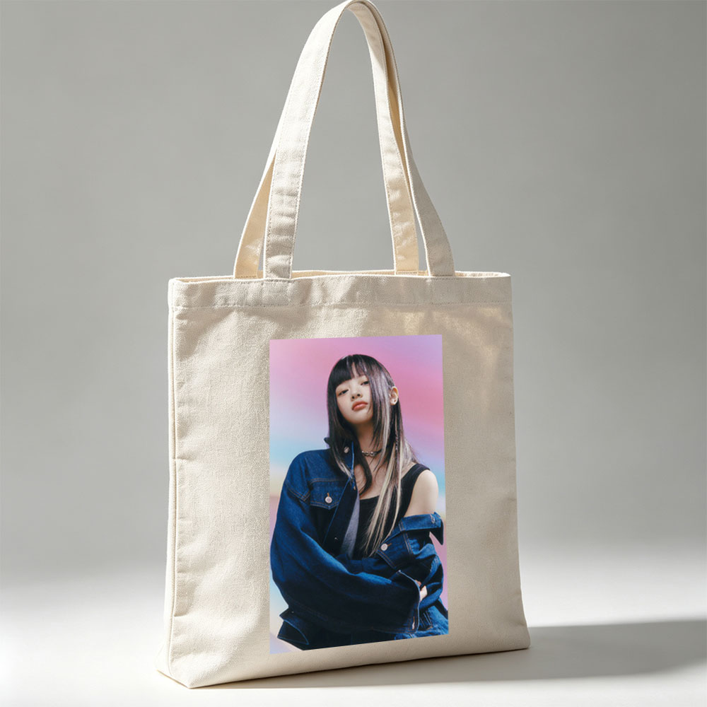 Hanni from NewJeans in a Stylish Denim Look Against a Vibrant Gradient Background - Canvas tote bags
