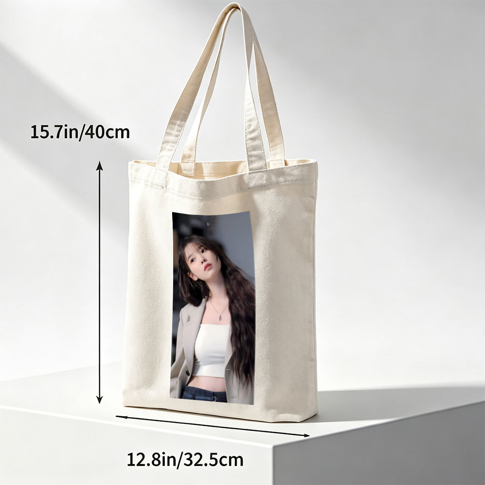 IU in a stylish outfit with a beige blazer and white crop top, showcasing her long wavy hair and elegant necklace. - Canvas tote bags