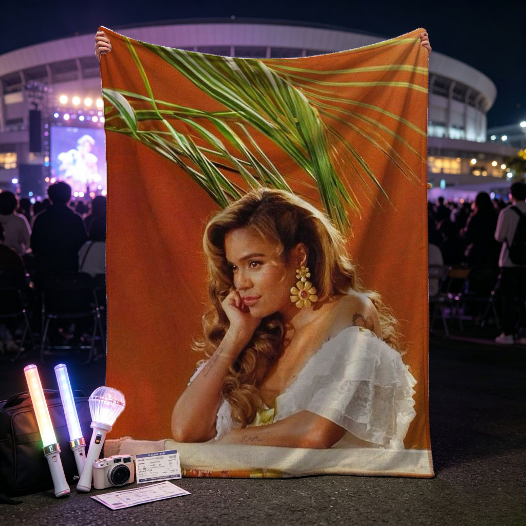 Maren Morris in a Tropical Scene Wearing a White Ruffled Dress with Palm Leaves in the Background - Blankets