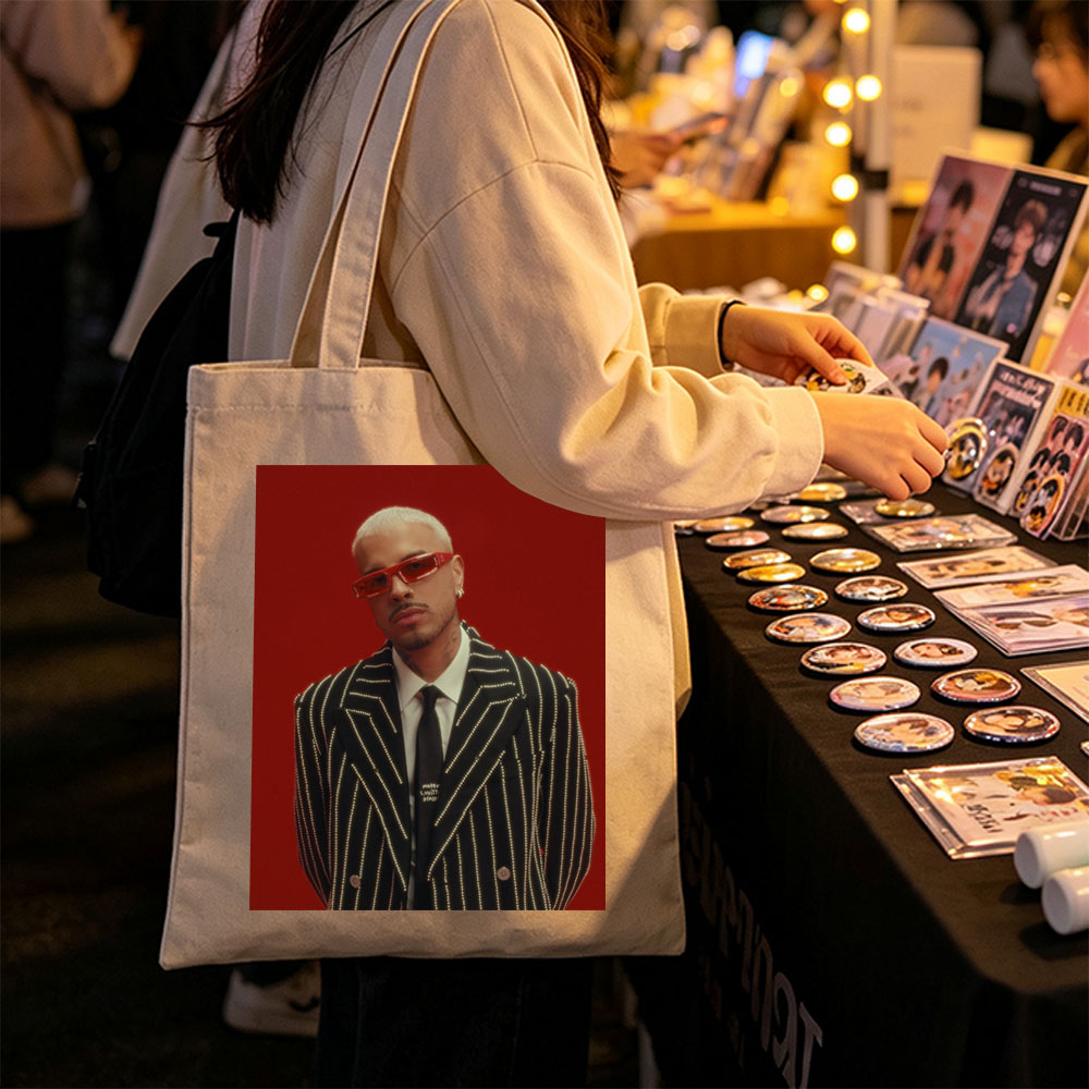 J Balvin in a Striking Red-Background Portrait Wearing a Glittering Black Suit and Red Sunglasses - Canvas tote bags