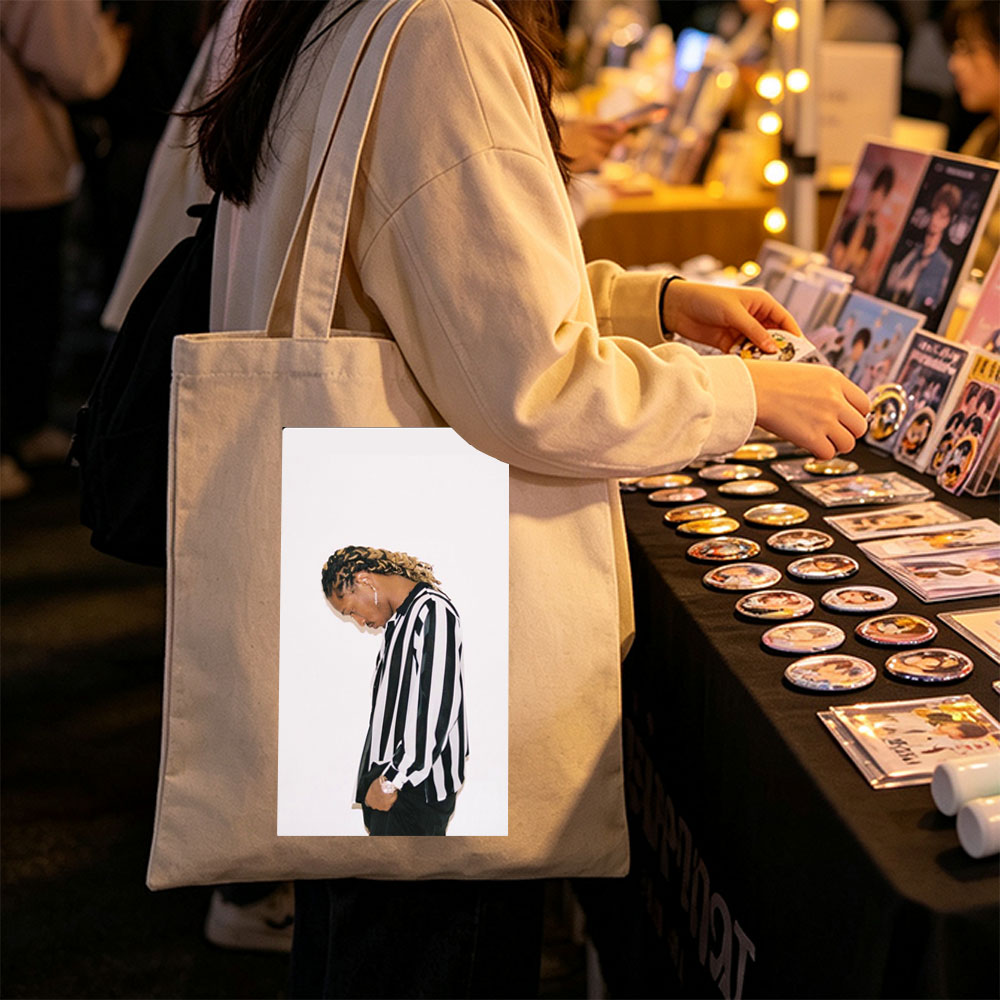 Lil Durk in a Striped Shirt with Braided Hair Against a White Background - Canvas tote bags