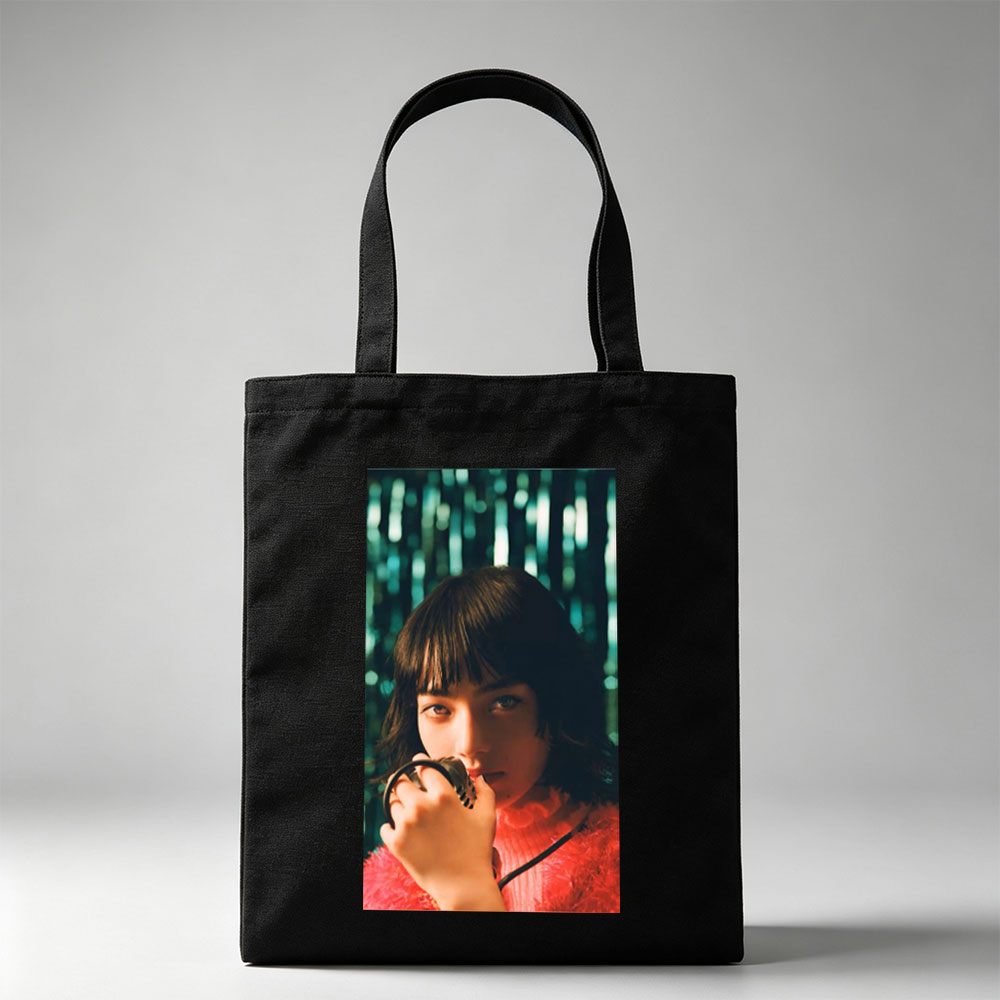 Smallville Actress Allison Mack in a Striking Red Outfit Holding a Microphone Against a Glittering Background - Canvas tote bags