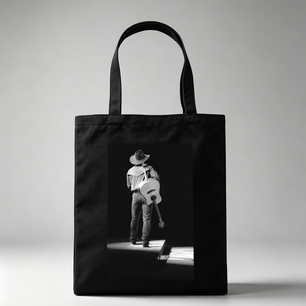 Willie Nelson on Stage with Acoustic Guitar in Black and White Portrait - Canvas tote bags