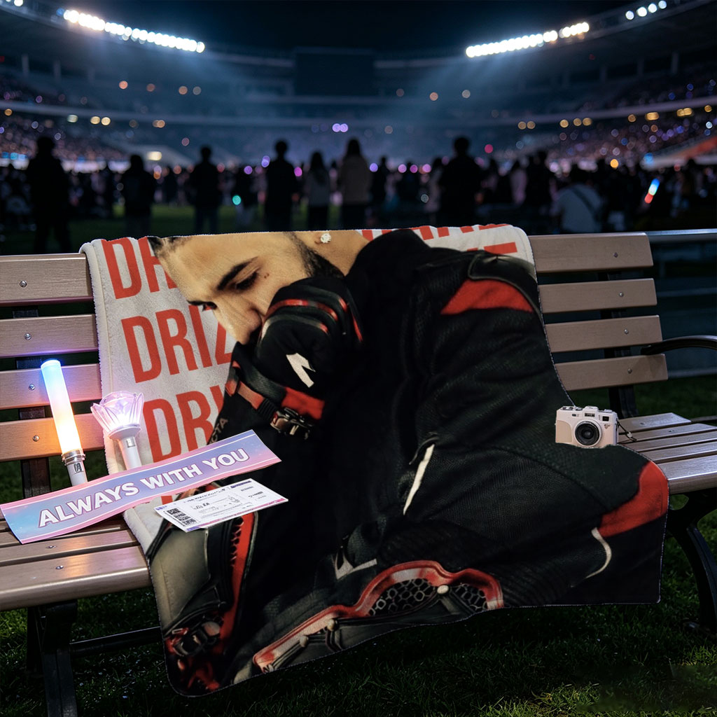 Drake in a Protective Gear Pose with Red and Black Motocross Suit Against Repeating 
