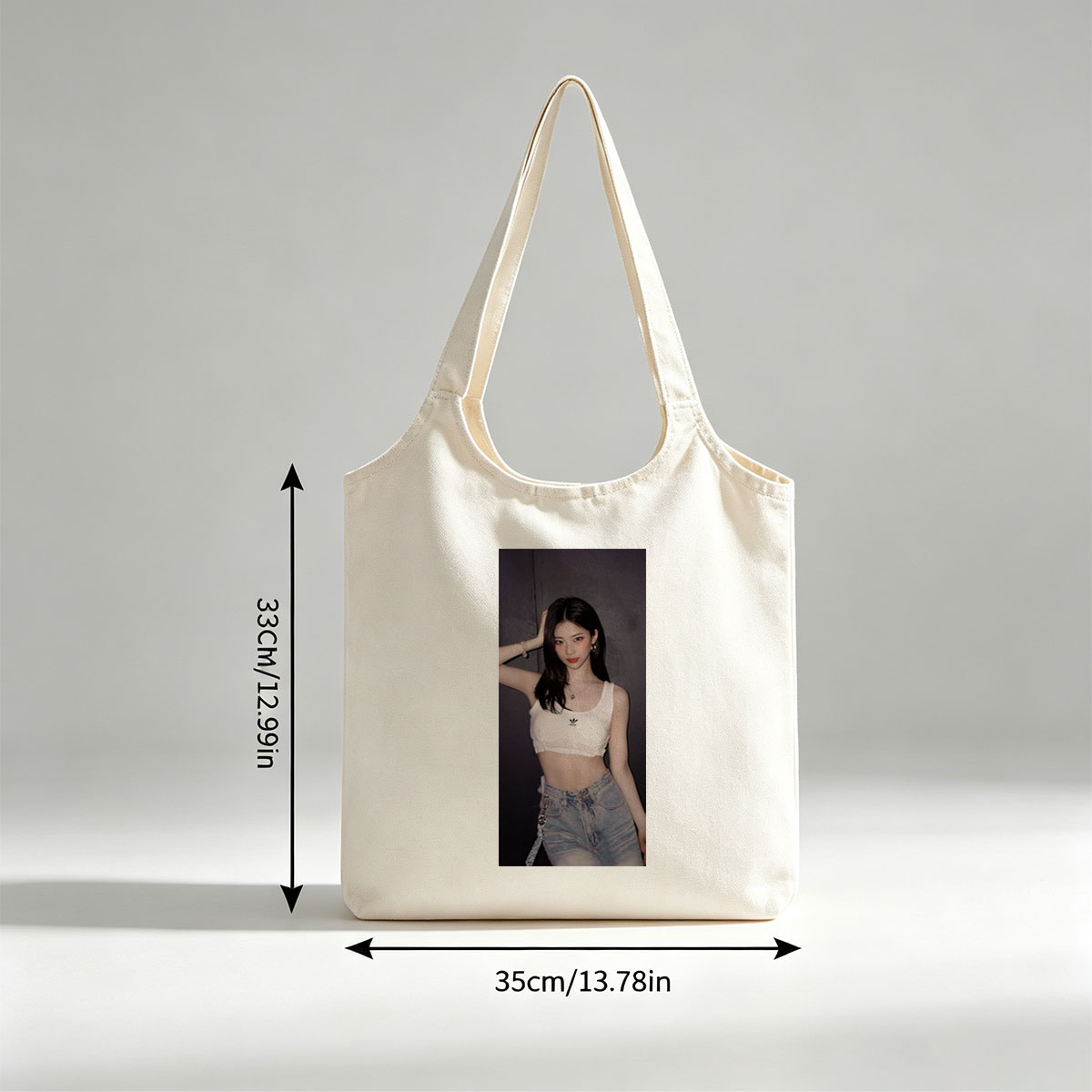 Korean Celebrity in Casual Outfit Wearing White Adidas Crop Top and High-Waisted Jeans Against Dark Background - Canvas shoulder bags/