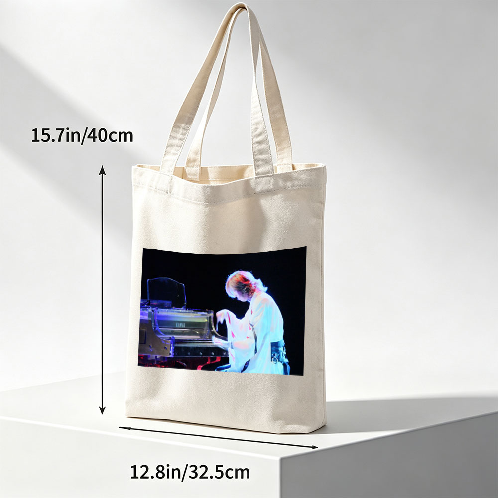 Yuki Kajiura Performing Piano on Stage with Dramatic Lighting - Canvas tote bags