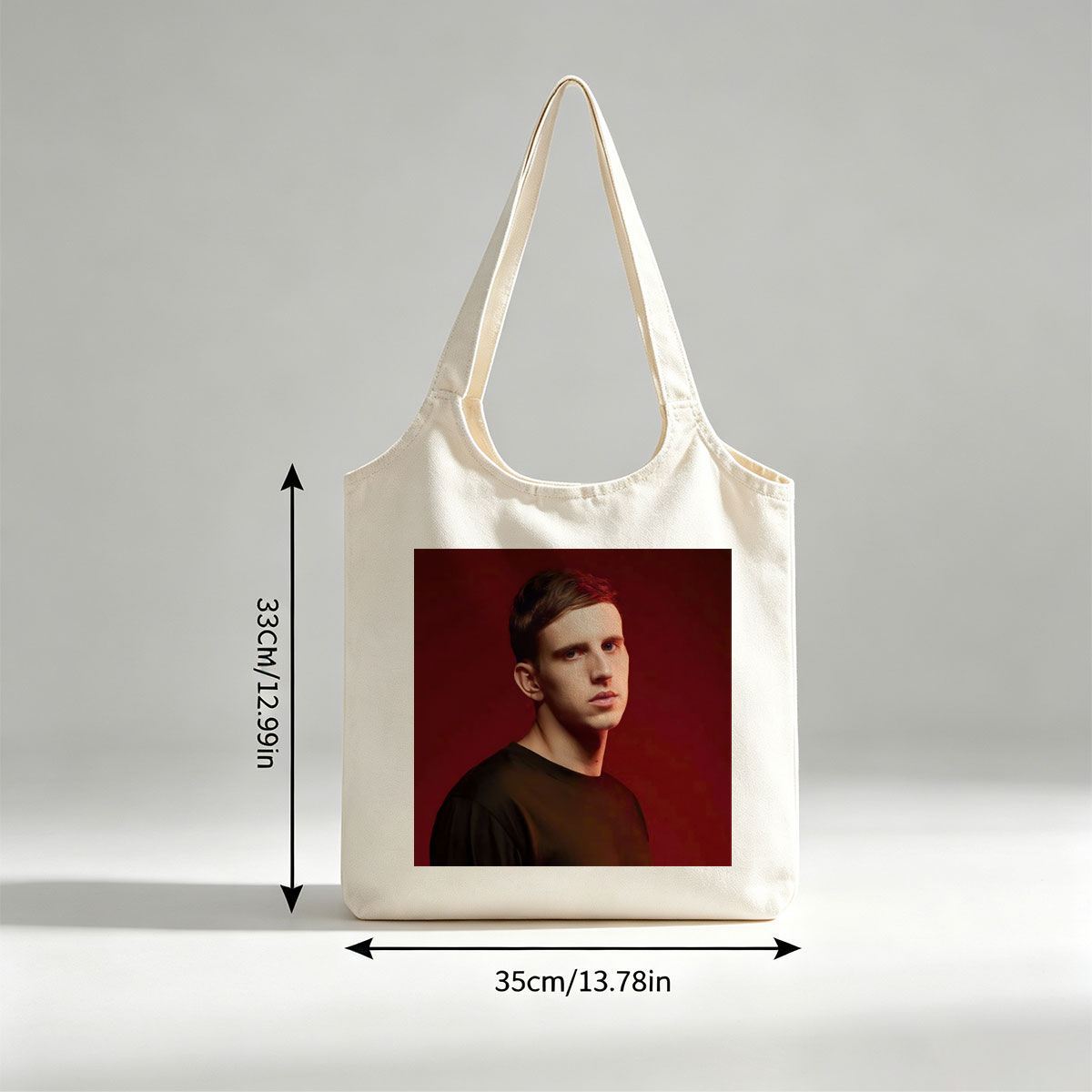 Martin Garrix in Studio Portrait Against Red Background - Canvas shoulder bags/