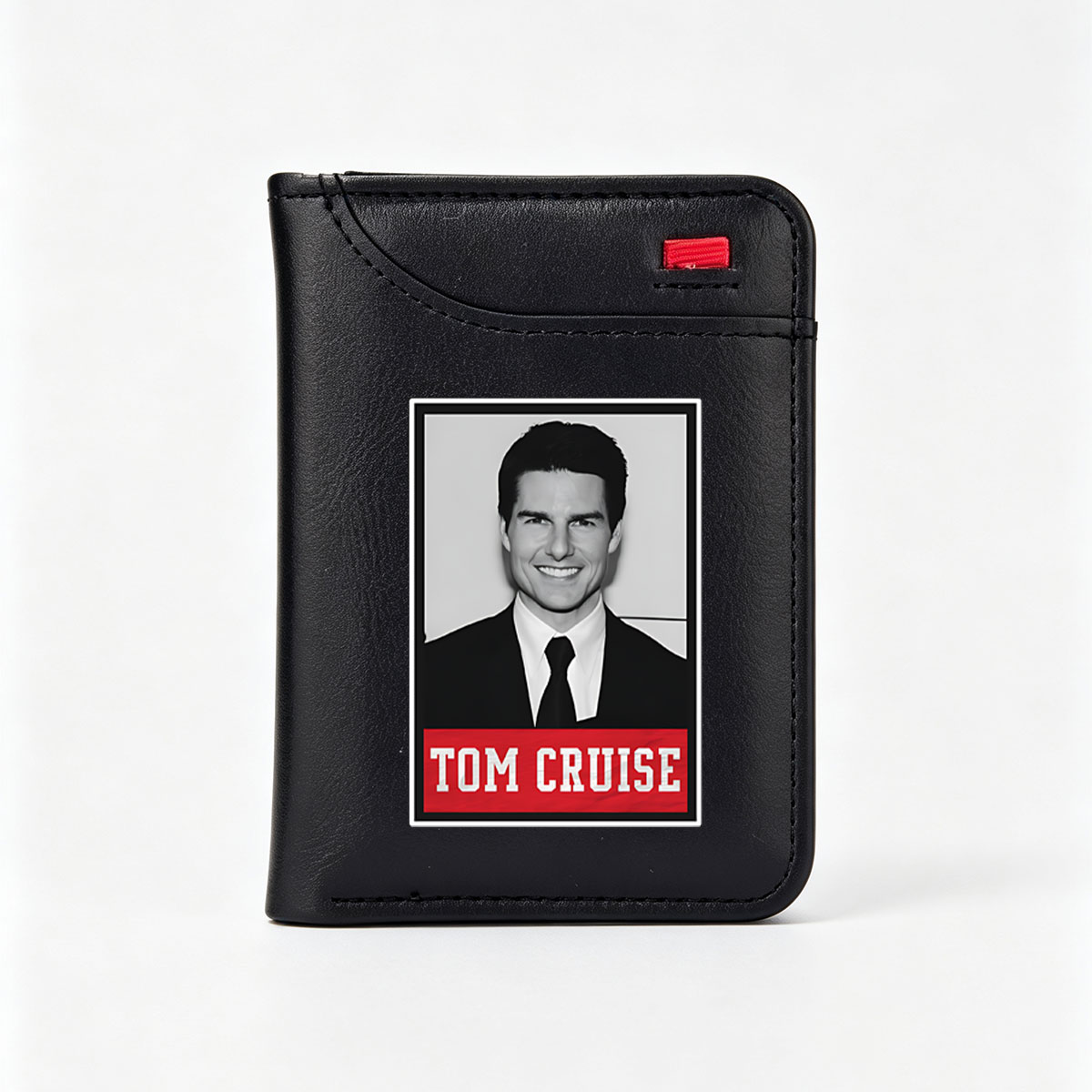 Tom Cruise in a formal suit and tie, smiling confidently. - Vertical Style Wallet