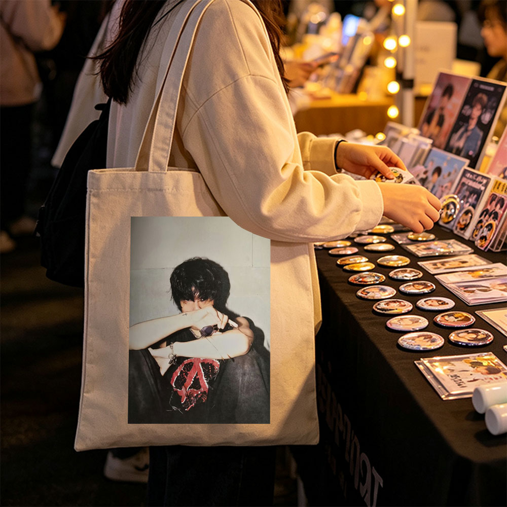 Hyunjin of Stray Kids in a Moody Pose with Sunglasses and Cross Tattoo, Wearing a Black T-Shirt with Red Peace Symbol Design - Canvas tote bags