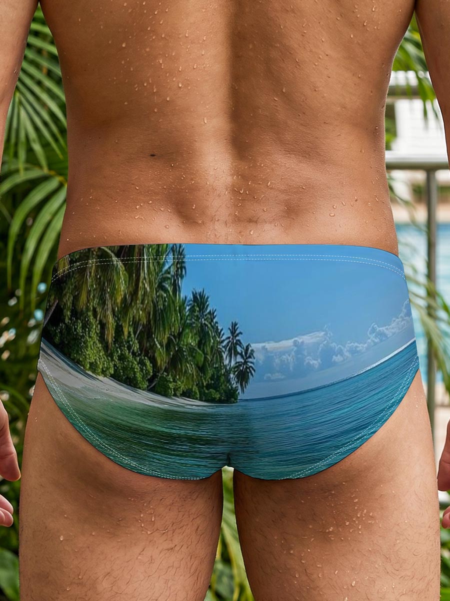 Crystal-clear turquoise waters meet a pristine white sand beach lined with lush palm trees under a bright blue sky. -  Men's swim trunks