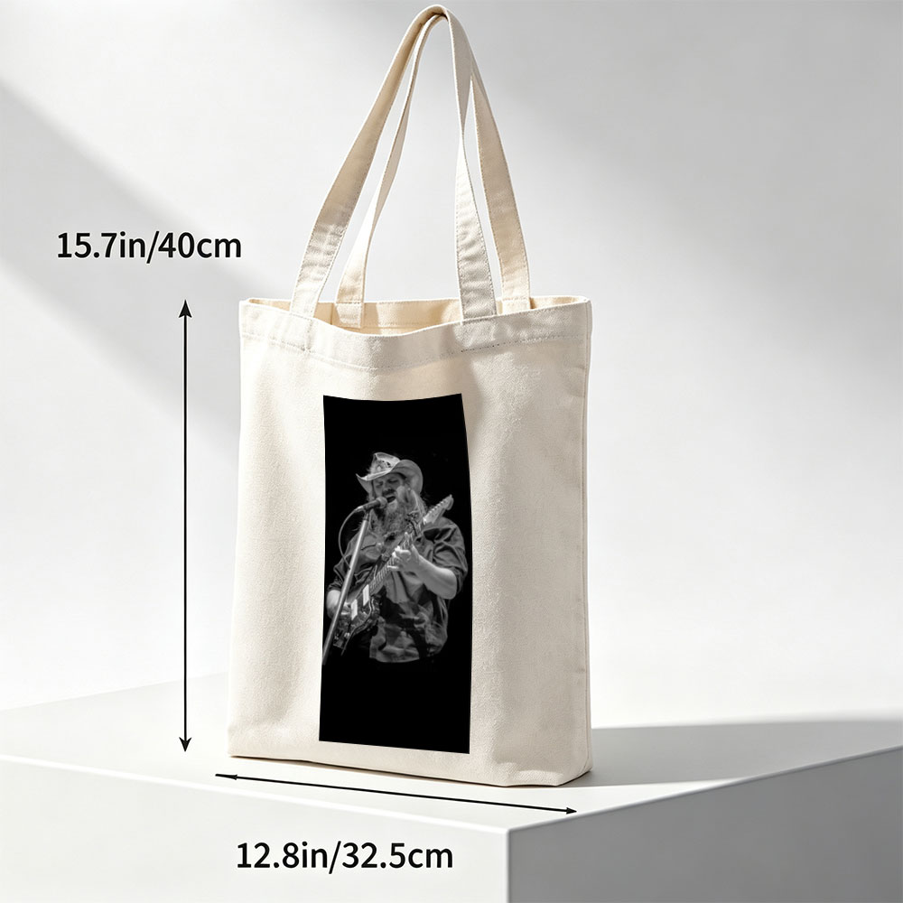 Chris Stapleton Performing Live with Guitar and Microphone on Stage - Canvas tote bags