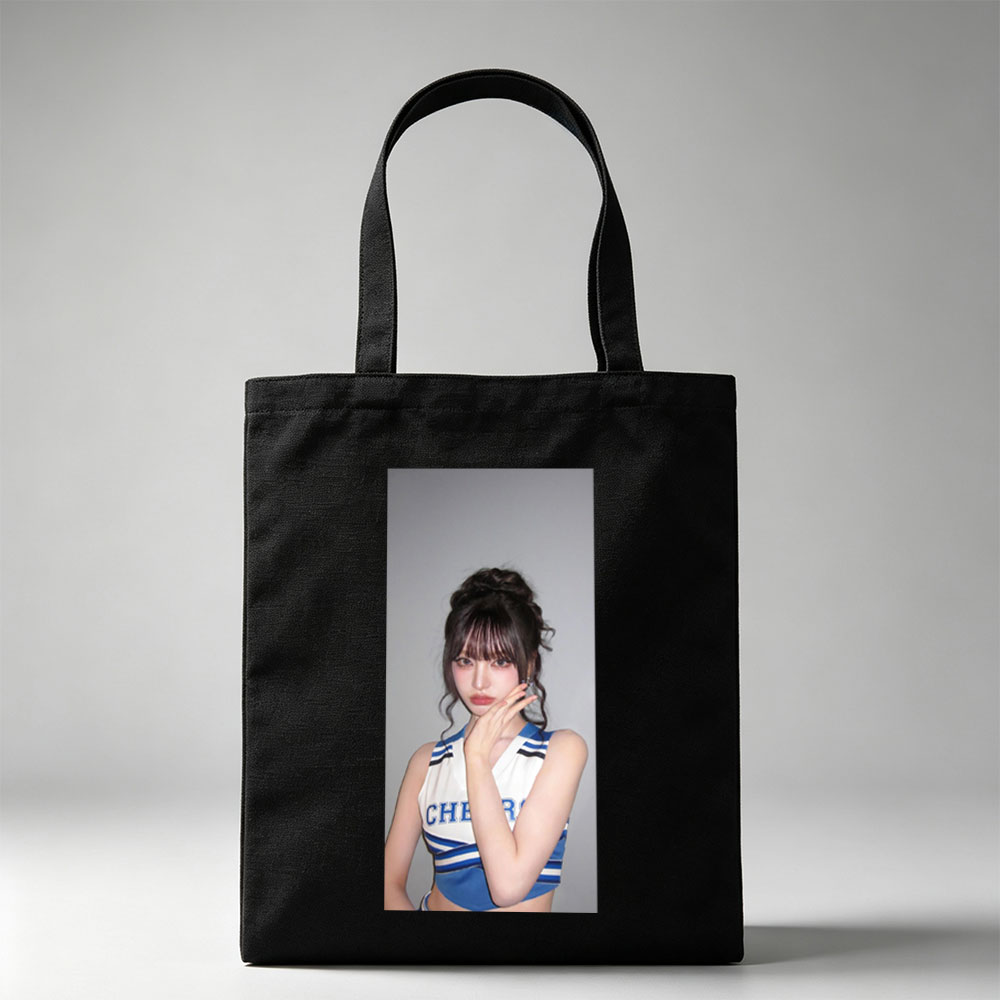 K-pop Idol in Cheerleader Outfit Poses with Hand on Face Against Gray Background - Canvas tote bags