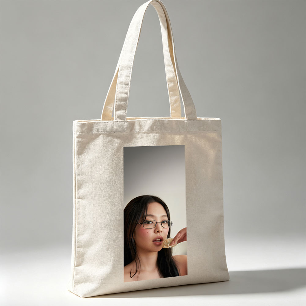 Jennie Kim Eating a Dumpling in a Minimalist Portrait - Canvas tote bags
