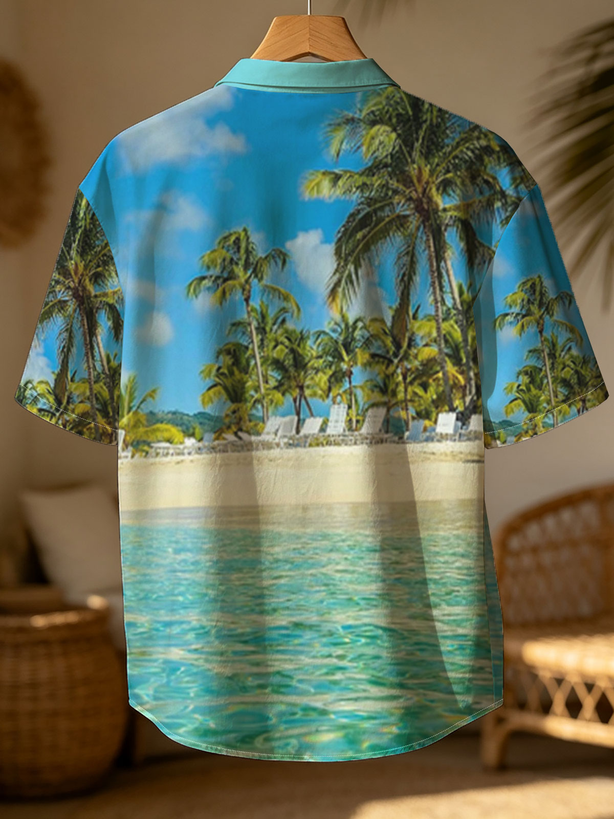 Crystal clear waters meet sandy beach with palm trees and lounge chairs under a bright blue sky. -  Shirt
