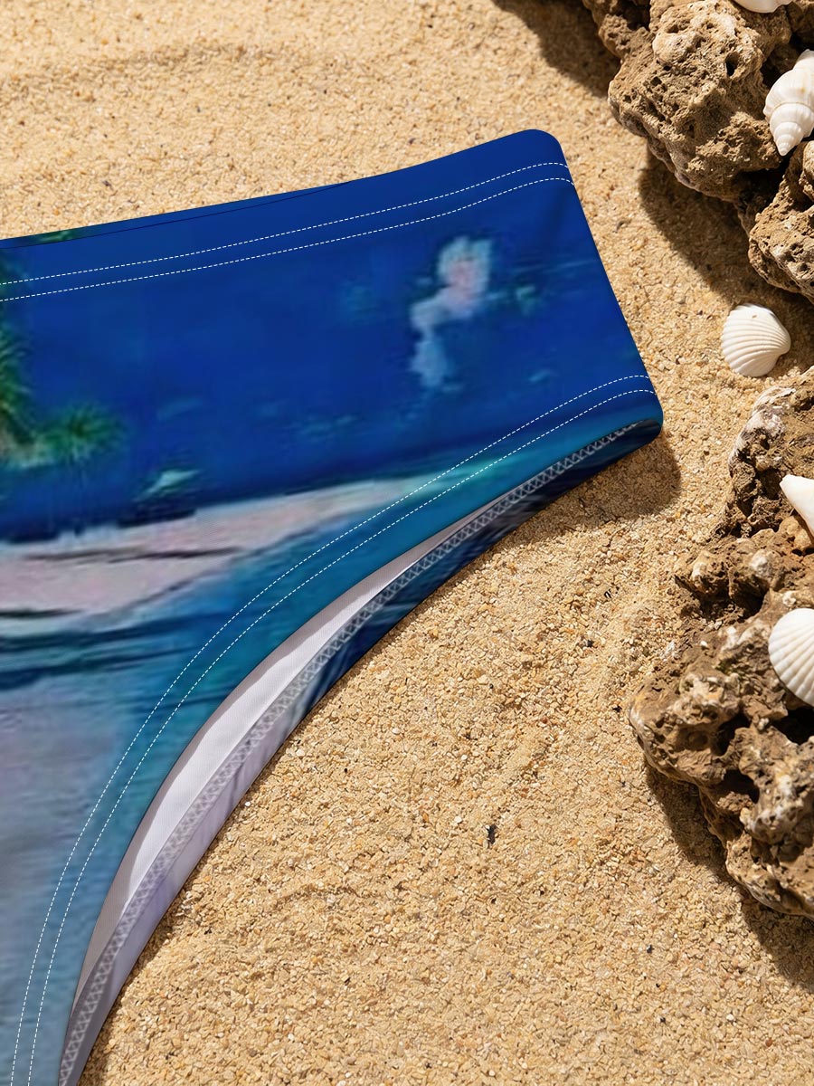 Serene beach with palm trees and turquoise waters under a clear blue sky. -  Men's swim trunks