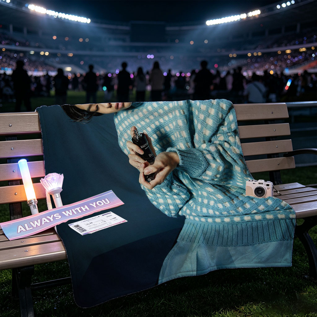 Jaden Smith in a Stylish Blue Sweater Holding a Perfume Bottle with Headphones On - Blankets