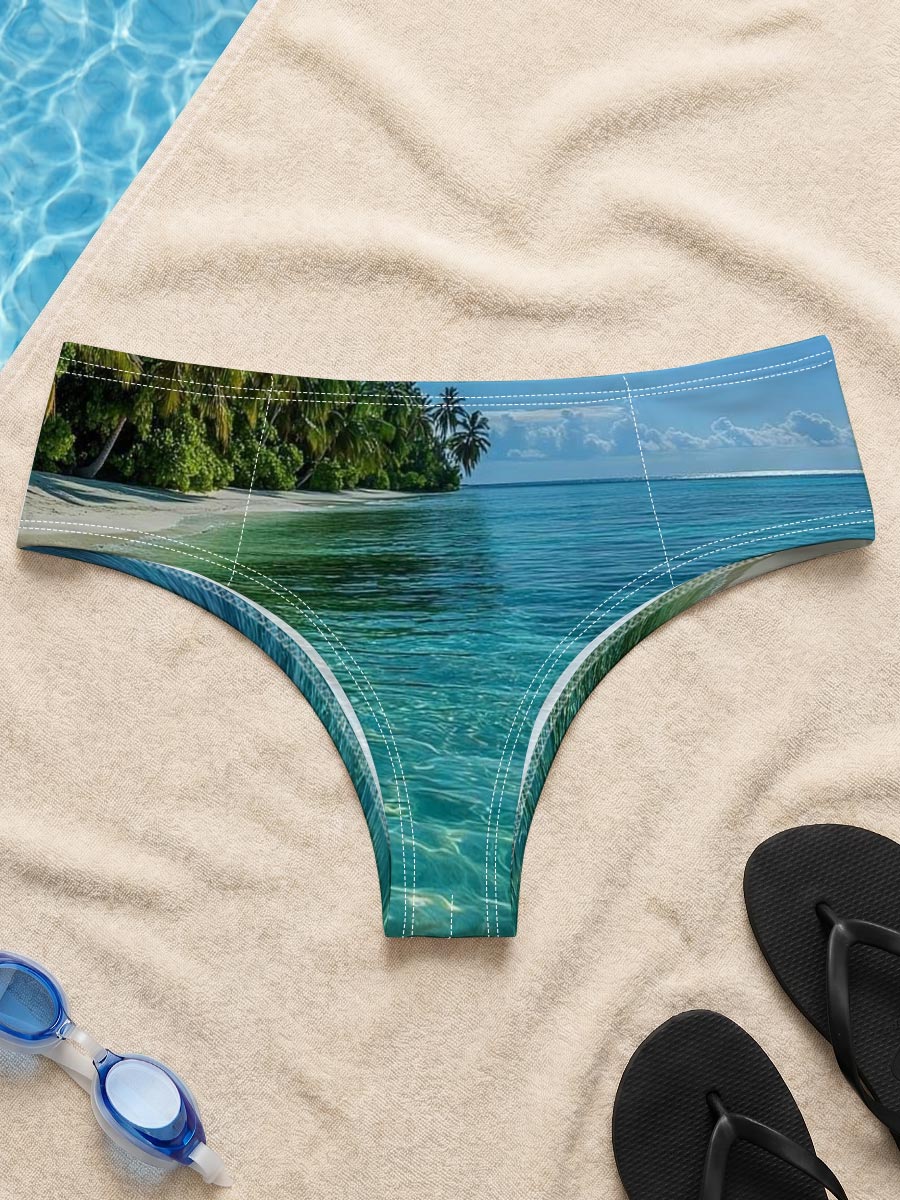 Crystal-clear turquoise waters meet a pristine white sand beach lined with lush palm trees under a bright blue sky. -  Men's swim trunks