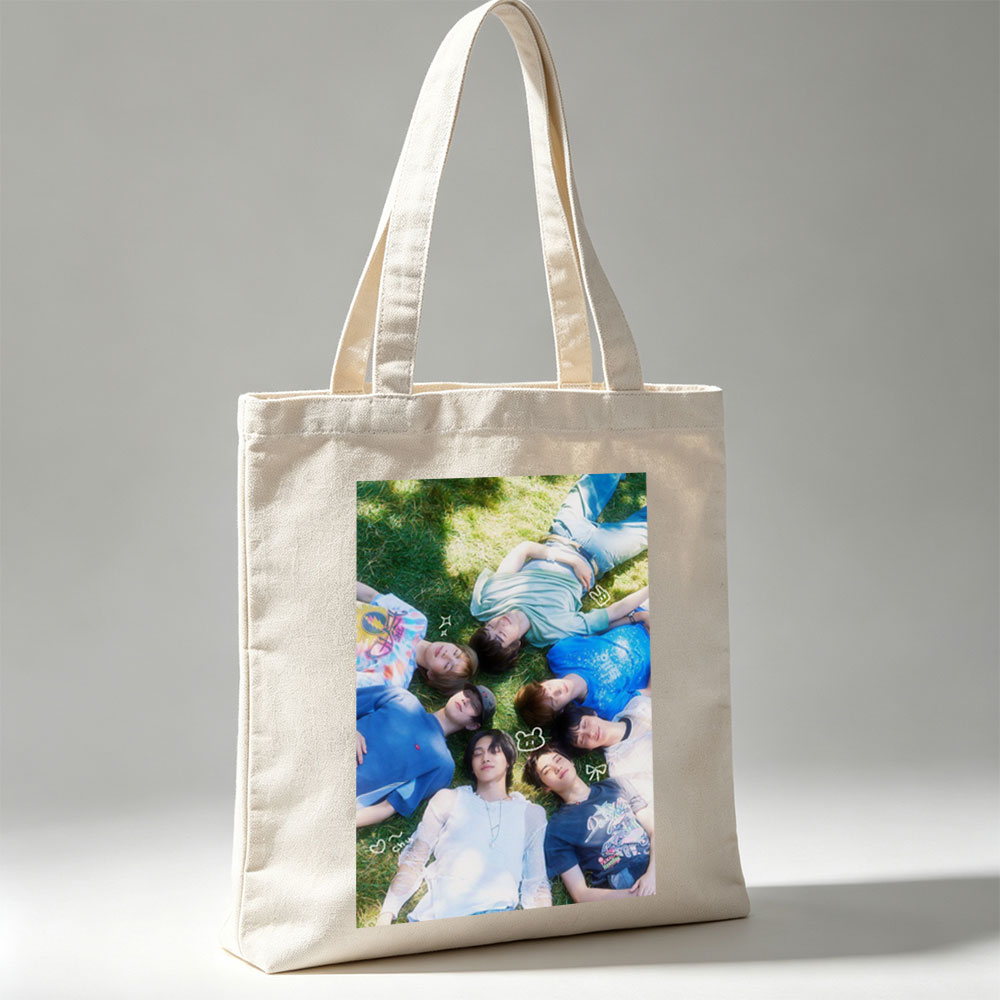 ENHYPEN Lying on Grass in a Circle with Playful Expressions and Cute Emojis - Canvas tote bags