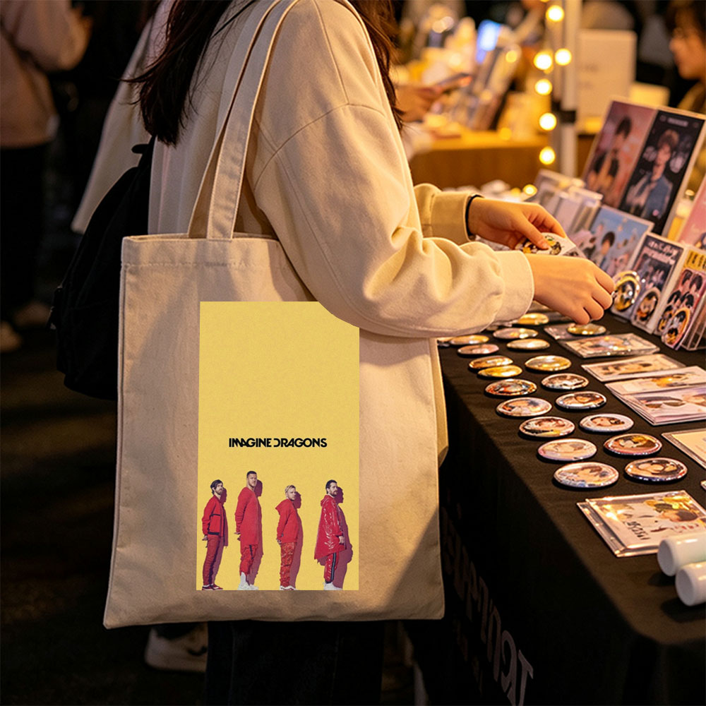 Imagine Dragons Standing in Red Outfits Against a Yellow Background - Canvas tote bags