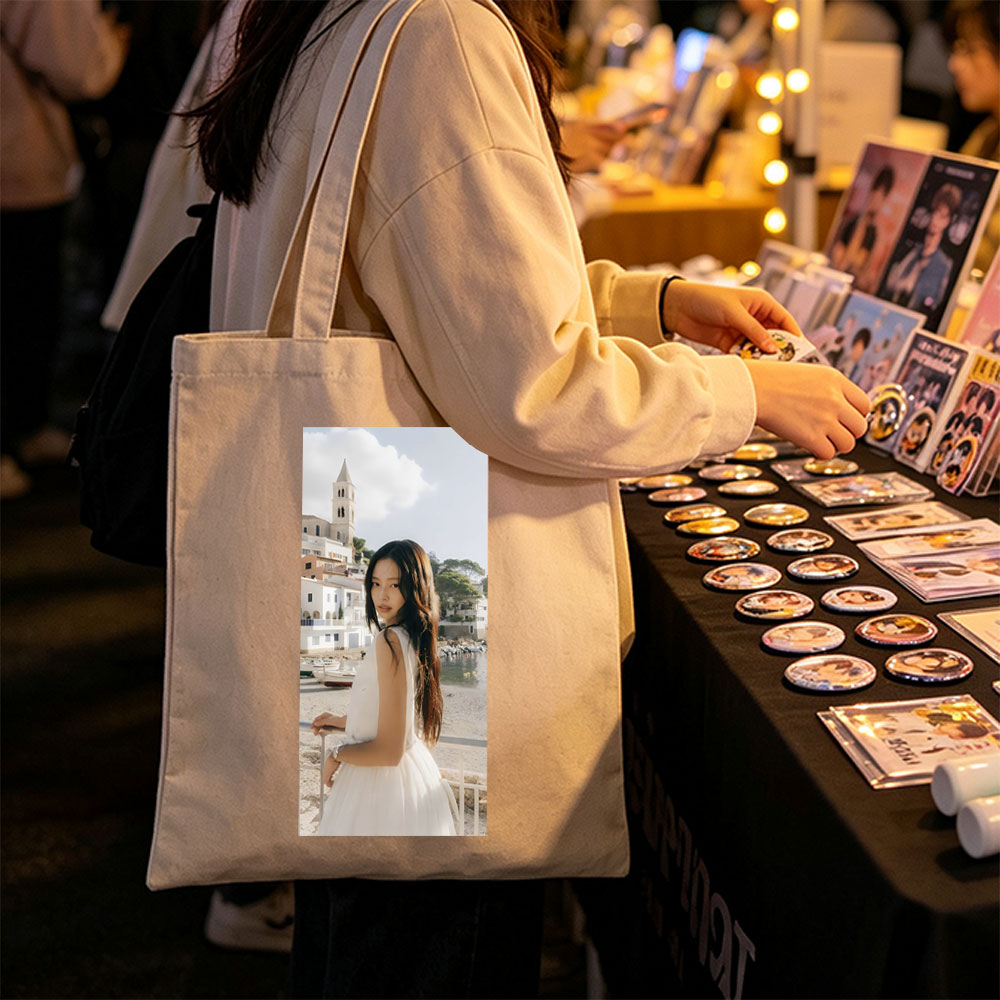 Jennie Kim in a White Dress by the Seaside with a Church Tower in the Background - Canvas tote bags