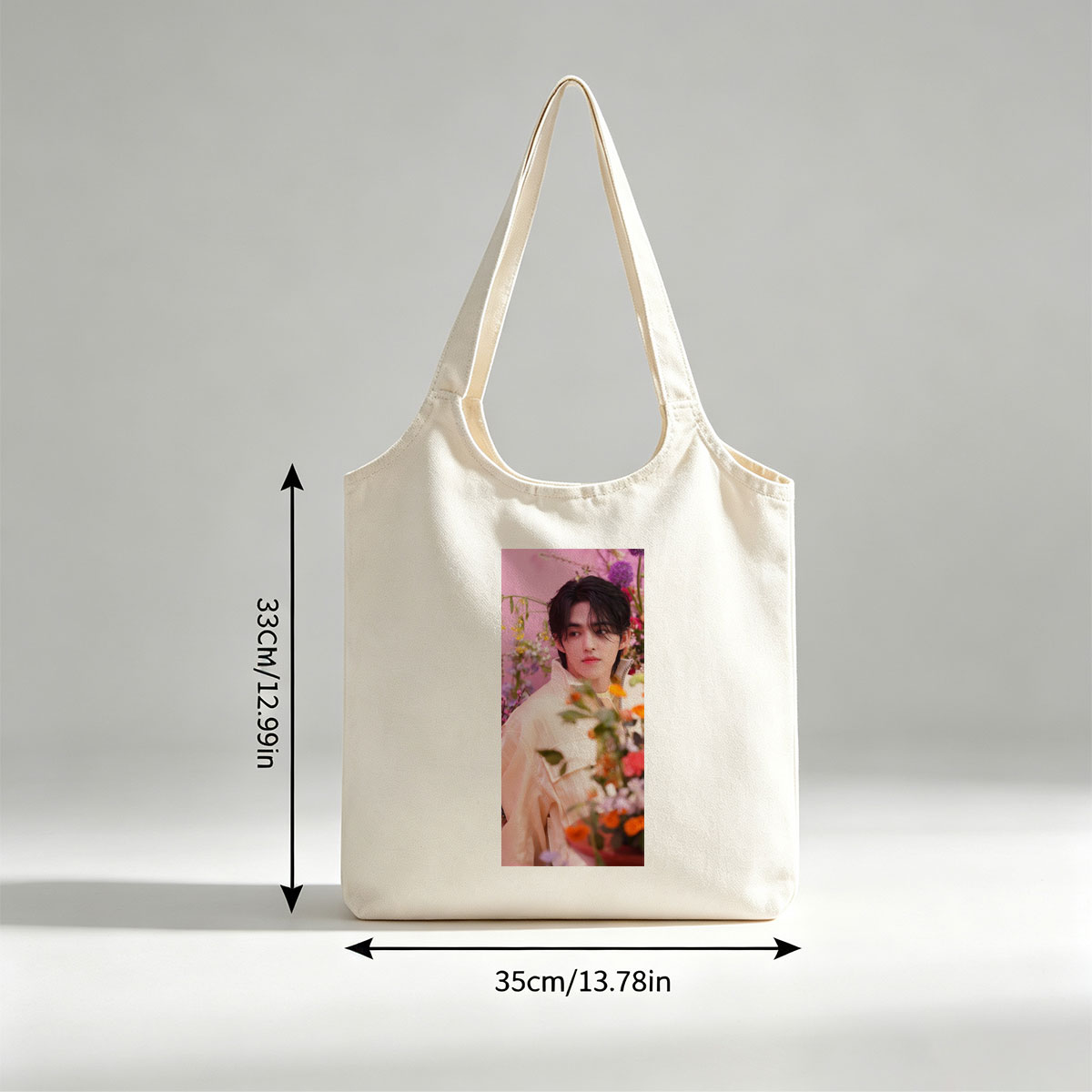 Sungchan in a floral garden, wearing a soft pink jacket with vibrant flowers in the foreground - Canvas shoulder bags/